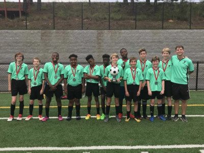 Kasey Radney with a children's soccer team.